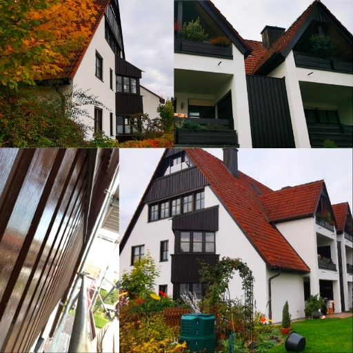 Professional painter at work on house exterior